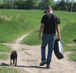 Alan with puppy following